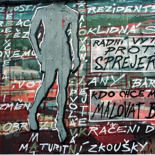 Graffiti protest mural with Czech/Slovak slogans.