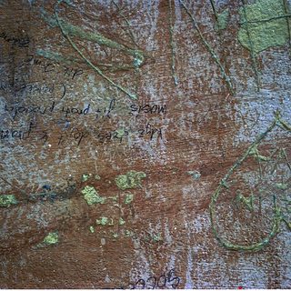 Graffiti on weathered concrete wall.
