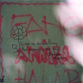 Graffiti on wall: "Love is something money can't buy. Berda, 30.8.2001" with