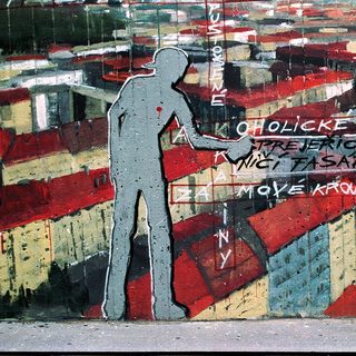 Urban mural with graffiti text and silhouette.