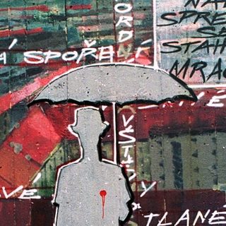 Urban mural with graffiti text and silhouette under umbrella.