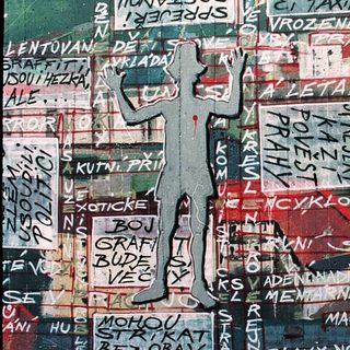 Vibrant graffiti mural with Czech political slogans.