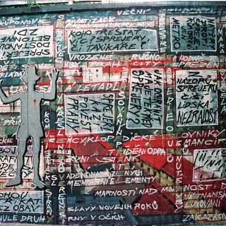 Vibrant graffiti mural with Czech political slogans.