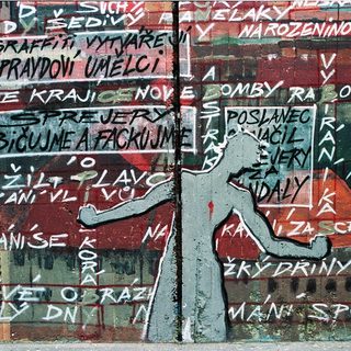 Street mural with Czech graffiti protest slogans.