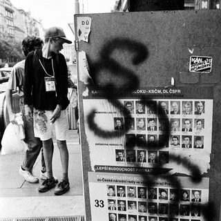 Missing persons posters vandalized with graffiti.