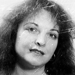 Wet-haired woman with expressive face, black-and-white.