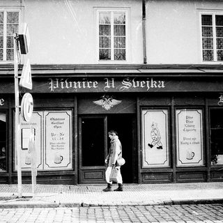 Classic beer hall entrance with man walking past.