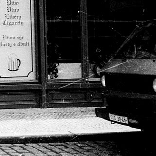 Classic beer hall entrance with man walking past.