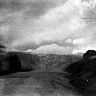 Mountain peak partially obscured by clouds.