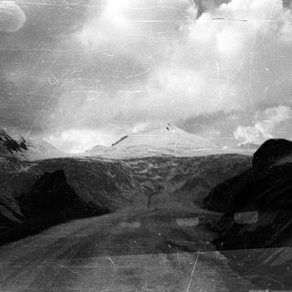 Mountainous landscape with snow-covered peaks.