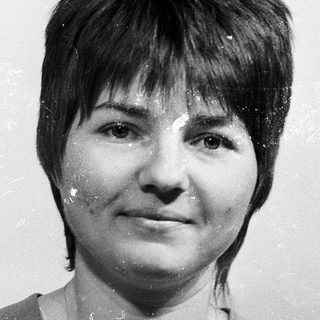 Black-and-white portrait of a woman with short hair.