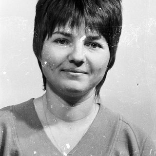 Black-and-white portrait of a woman with short hair.
