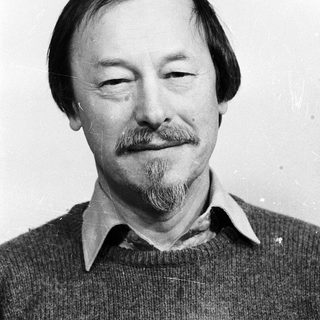 Portrait of a middle-aged man with beard and mustache.