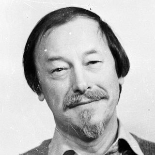 Black-and-white portrait of a middle-aged man with mustache.