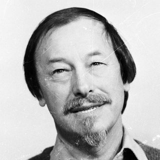 Portrait of a middle-aged man with beard and mustache.