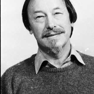 Portrait of a middle-aged man with beard and mustache.
