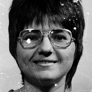 Vintage portrait of woman wearing glasses.