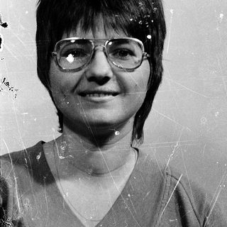 Vintage portrait of woman wearing glasses.