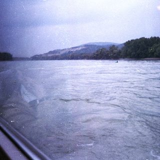 Scenic view of river with distant hills.