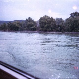 Scenic river view with forested shoreline.