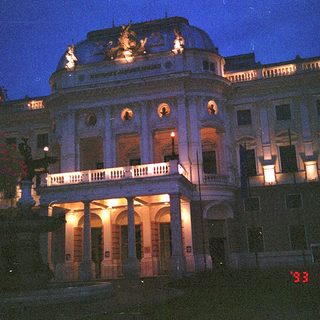 Elegant building illuminated at night.