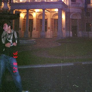 Neoclassical building illuminated at night.