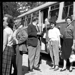 People boarding vintage bus labeled "Horecky" in 1950s.