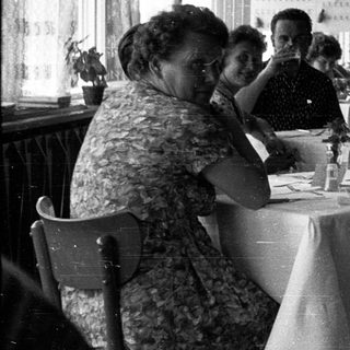 Group of women dining together indoors.