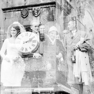 Relief sculpture depicting nurses and doctors with clock.