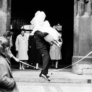 People exiting a building during wartime rationing.