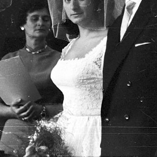 Black-and-white wedding ceremony with bride and groom.