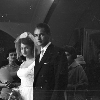Black-and-white wedding ceremony with bride and groom.