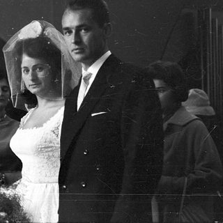 Black-and-white wedding ceremony with bride and groom.