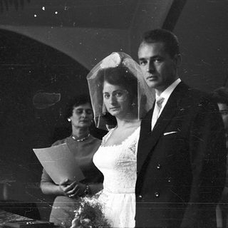 Black-and-white wedding ceremony with bride and groom.
