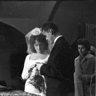 Classic black-and-white wedding portrait with bride and groom.