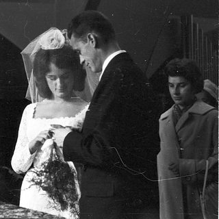 Classic black-and-white wedding portrait with bride and groom.