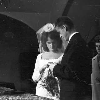 Classic black-and-white wedding portrait with bride and groom.