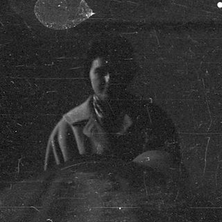 Ethereal bride with veil in dimly lit, starry setting.