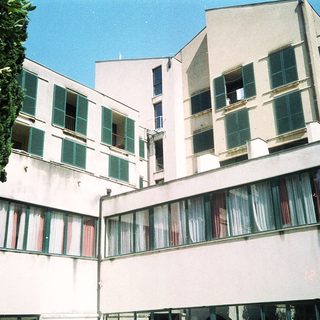 Modernist apartment building with balconies.