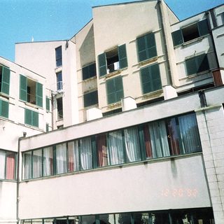 Modernist apartment building with balconies.