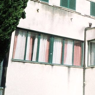 Modernist apartment building with balconies.