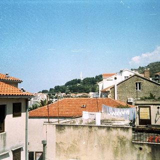 Rural Mediterranean village with red-tiled roofs.