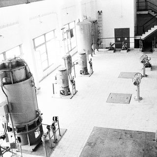 Industrial facility with large fermentation or processing tanks.