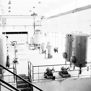 Industrial facility with large pressure vessels and piping.