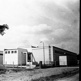 Industrial building complex with modernist architecture.