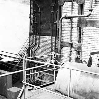 Industrial facility with vintage machinery and piping.