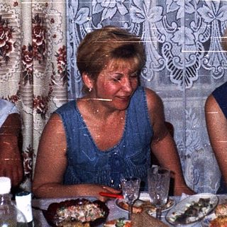 Family gathering enjoying meal indoors.