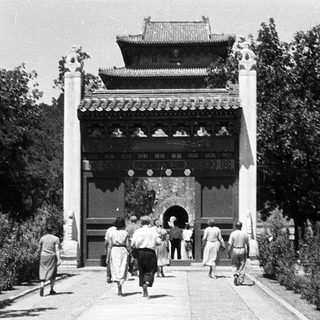 Traditional East Asian temple entrance with visitors.
