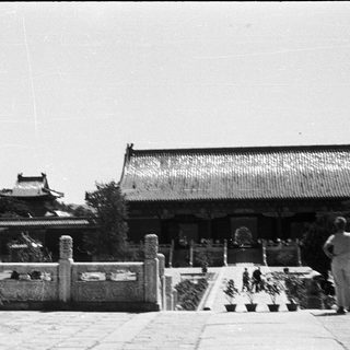 Traditional East Asian temple courtyard with classical architecture.