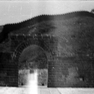 Archway entrance to ancient stone structure.